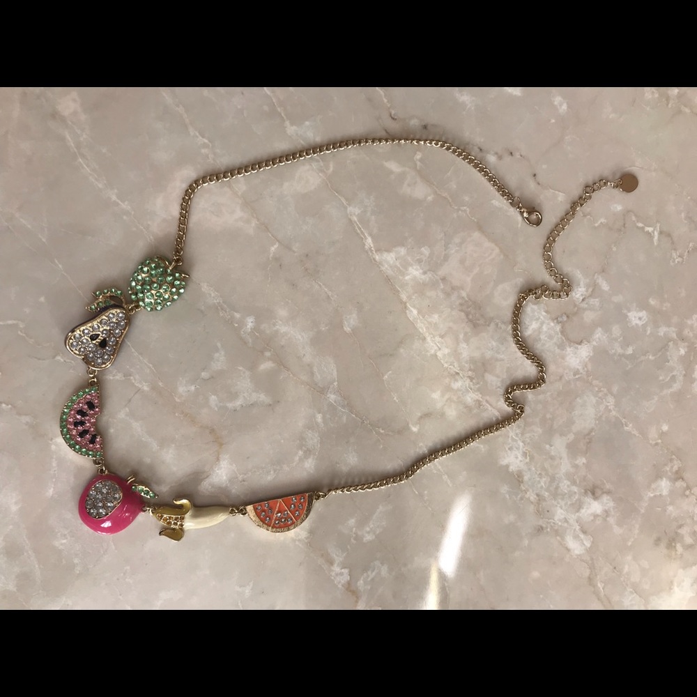 Gold fruit necklace.